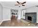 Open concept living room with hardwood floors and views into kitchen at 835 Belmont Ave, Charlotte, NC 28205