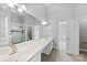 Elegant bathroom featuring double vanity and a shower at 8506 Delamere Ln, Charlotte, NC 28269