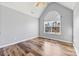 Charming bedroom with hardwood floors and arched window at 8506 Delamere Ln, Charlotte, NC 28269