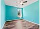 Charming bedroom with teal walls and wood-look flooring at 8506 Delamere Ln, Charlotte, NC 28269