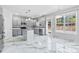 Modern kitchen with gray cabinets and island at 8506 Delamere Ln, Charlotte, NC 28269