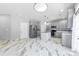 Modern kitchen featuring stainless steel appliances and marble-look flooring at 8506 Delamere Ln, Charlotte, NC 28269