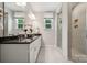 Double vanity bathroom with a large shower and modern fixtures at 8625 Miles Gap Rd, Indian Land, SC 29707