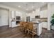 Modern kitchen with white cabinets, stainless steel appliances, and an island at 8625 Miles Gap Rd, Indian Land, SC 29707