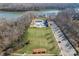 Aerial view of community pool, clubhouse, and lake access at 9124 Longvale Ln, Charlotte, NC 28214