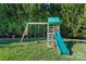 playset with swings and slide in backyard at 9124 Longvale Ln, Charlotte, NC 28214