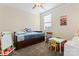 bedroom with twin bed, desk, and toys at 9124 Longvale Ln, Charlotte, NC 28214