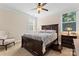 Secondary bedroom with a comfortable sitting area and natural light at 9124 Longvale Ln, Charlotte, NC 28214