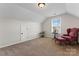 Bonus room with window, armchair, and ottoman at 9124 Longvale Ln, Charlotte, NC 28214