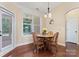 Cozy breakfast nook with wood table and chairs at 9124 Longvale Ln, Charlotte, NC 28214