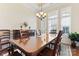 Bright dining room with large windows and wooden table at 9124 Longvale Ln, Charlotte, NC 28214