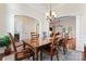 Elegant dining room with hardwood floors and a chandelier at 9124 Longvale Ln, Charlotte, NC 28214