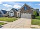 Ranch style home with stone and siding exterior, two-car garage at 9124 Longvale Ln, Charlotte, NC 28214