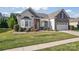 Craftsman style home with stone exterior and lush landscaping at 9124 Longvale Ln, Charlotte, NC 28214