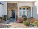 Inviting front entrance with stone detailing and landscaping at 9124 Longvale Ln, Charlotte, NC 28214