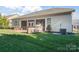 House back exterior with patio, grill station, and screened porch at 9124 Longvale Ln, Charlotte, NC 28214