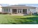 House back exterior with patio, grill, and screened porch at 9124 Longvale Ln, Charlotte, NC 28214