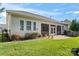 House back exterior featuring a screened porch and patio at 9124 Longvale Ln, Charlotte, NC 28214