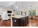 Modern kitchen with large island, open to living area at 9124 Longvale Ln, Charlotte, NC 28214