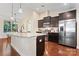 Modern kitchen with dark cabinetry and granite island at 9124 Longvale Ln, Charlotte, NC 28214