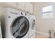 Convenient laundry room with LG washer and dryer included at 9124 Longvale Ln, Charlotte, NC 28214