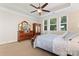 Main bedroom with large windows and wooden furniture at 9124 Longvale Ln, Charlotte, NC 28214