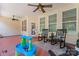 Screened porch with rocking chairs and access to backyard at 9124 Longvale Ln, Charlotte, NC 28214