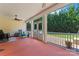 Screened porch with rocking chairs and built-in grill at 9124 Longvale Ln, Charlotte, NC 28214