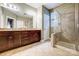 Double vanity bathroom with granite countertops and a large shower at 1009 Chapman St, Indian Trail, NC 28079