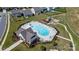 Aerial view of community pool with lounge chairs and nearby playground at 1009 Chapman St, Indian Trail, NC 28079