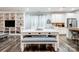 Dining area with white table and bench, adjacent to kitchen at 1009 Chapman St, Indian Trail, NC 28079