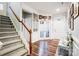 Bright entryway with hardwood floors, staircase, and bench at 1009 Chapman St, Indian Trail, NC 28079