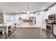 Kitchen with granite island, white cabinets, and stainless steel appliances at 1009 Chapman St, Indian Trail, NC 28079