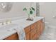 Bright bathroom featuring double sinks with wood cabinets and ample countertop space at 10200 Amsterdam Dr, Mount Pleasant, NC 28124