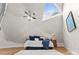Cozy bedroom features a unique triangular window and hardwood floors at 10200 Amsterdam Dr, Mount Pleasant, NC 28124