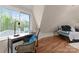 Comfortable bedroom features a built-in desk with a beautiful wooded view at 10200 Amsterdam Dr, Mount Pleasant, NC 28124