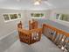 Bright bonus room with unique wooden staircase and plenty of sunlight at 10200 Amsterdam Dr, Mount Pleasant, NC 28124