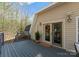 Outdoor deck featuring a cozy entry and ample seating areas at 10200 Amsterdam Dr, Mount Pleasant, NC 28124