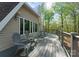 A beautiful deck with outdoor seating and wooded views, perfect for relaxation and entertaining guests at 10200 Amsterdam Dr, Mount Pleasant, NC 28124