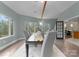 Open dining area with tile floors and large windows, seamlessly connects to other living spaces at 10200 Amsterdam Dr, Mount Pleasant, NC 28124