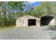 Metal garage with door open showing bare interior at 10200 Amsterdam Dr, Mount Pleasant, NC 28124