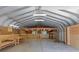 Metal garage interior featuring a loft with work benches at 10200 Amsterdam Dr, Mount Pleasant, NC 28124