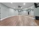 Home gym with mirrored walls, hardwood floors and space for activities at 10200 Amsterdam Dr, Mount Pleasant, NC 28124