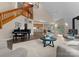 Spacious living room with wood burning stove, cathedral ceilings, hardwood floors, and piano at 10200 Amsterdam Dr, Mount Pleasant, NC 28124