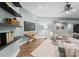 Bright living room with comfortable seating and floating shelves at 10200 Amsterdam Dr, Mount Pleasant, NC 28124