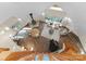Bright living room boasts vaulted ceilings, wood floors, fireplace, and ample seating at 10200 Amsterdam Dr, Mount Pleasant, NC 28124