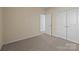 Well-lit bedroom with neutral walls and carpet at 1024 Knob Creek Ln, Fort Mill, SC 29708