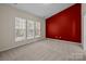 Bedroom with three windows, neutral wall colors and carpet at 1024 Knob Creek Ln, Fort Mill, SC 29708