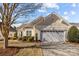 House exterior showcasing a light beige color scheme and landscaping at 1024 Knob Creek Ln, Fort Mill, SC 29708