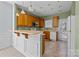 Kitchen with light wood cabinets, neutral countertops, and door access at 1024 Knob Creek Ln, Fort Mill, SC 29708